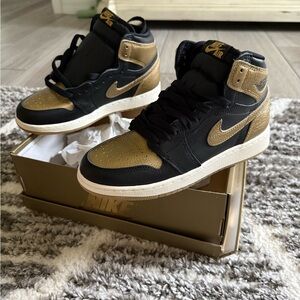 Nike Air Jordan Black and Gold High-Tops
